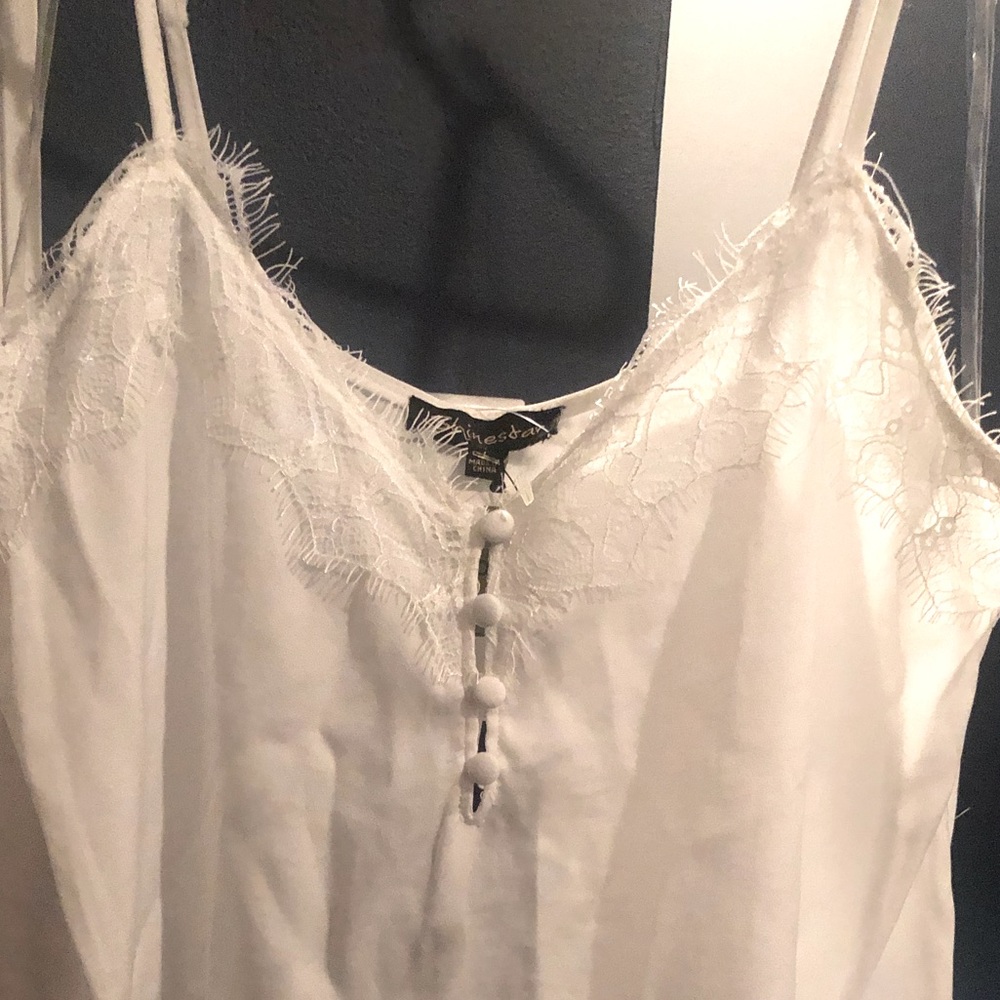 White tank top. Super cute fringe design with detailed buttons. Sz L with tags